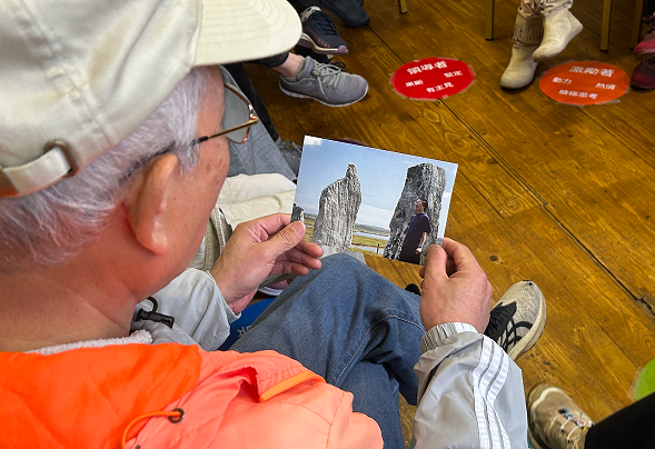 Participant with postcard